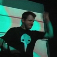 Chiptune Musician Bit Shifter sporting an Evangelion T-Shirt